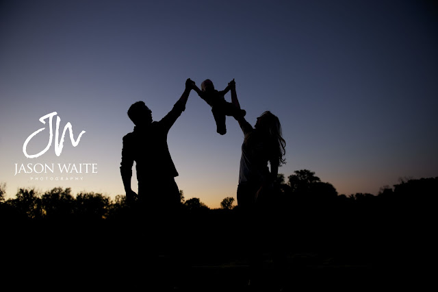 a family of three silhouette at river legacy park