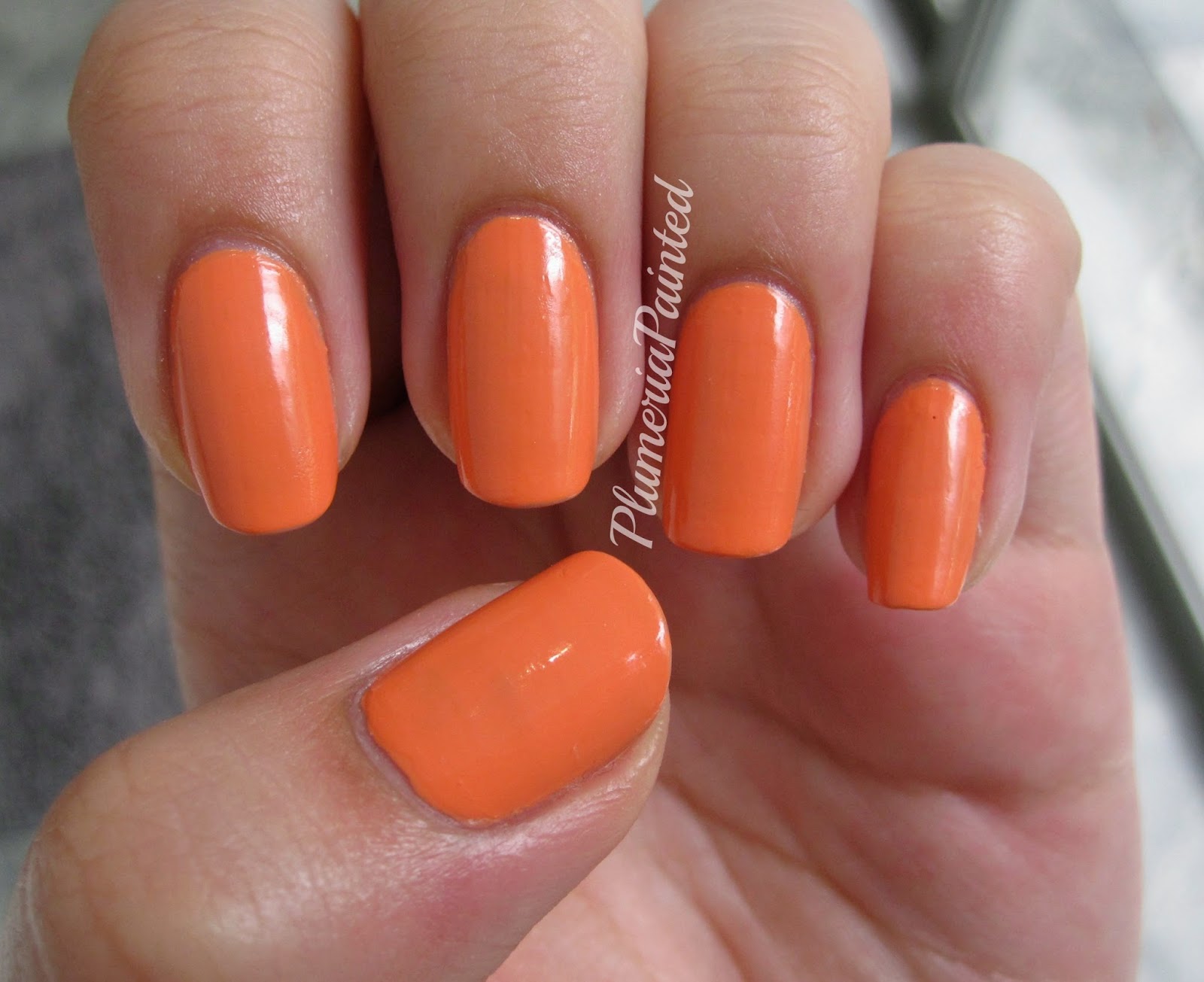 orange opi with nail design