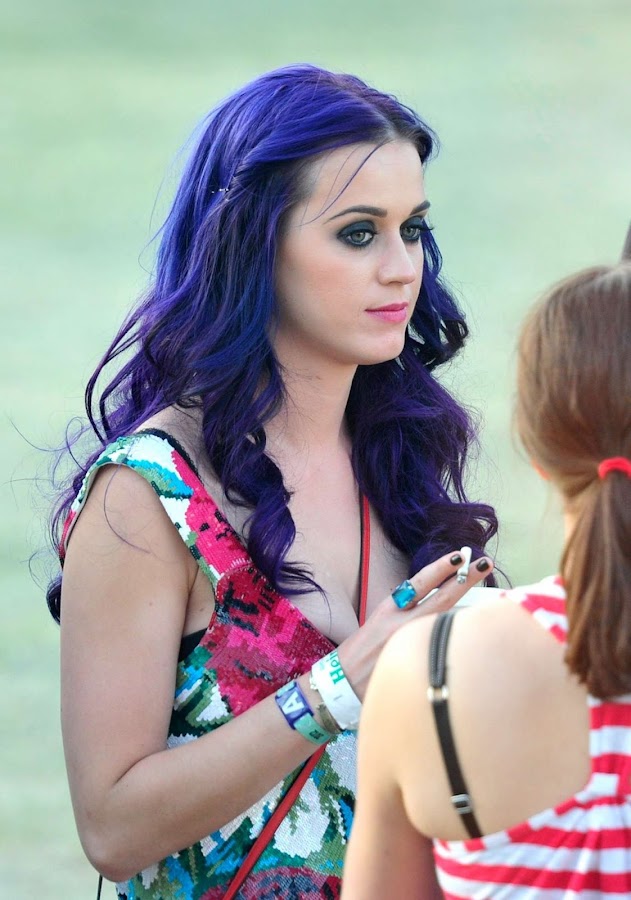 Katy Perry having a smoke and talking to her friends at 2012 Coachella Valley Music and Arts Festival