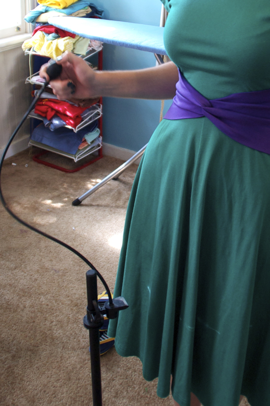 Sewing with shortening a dress.