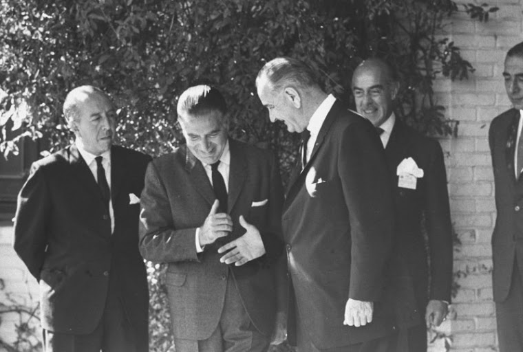 Pres. Lyndon B. Johnson (3L) talking with Fernando Belaunde (2L) at Summit conference.