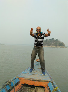 Boat ride to Umakananda Island, the World's smallest river Island.