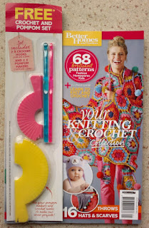Front cover of the magazine with crochet hooks and pom pom makers packaged on the front.