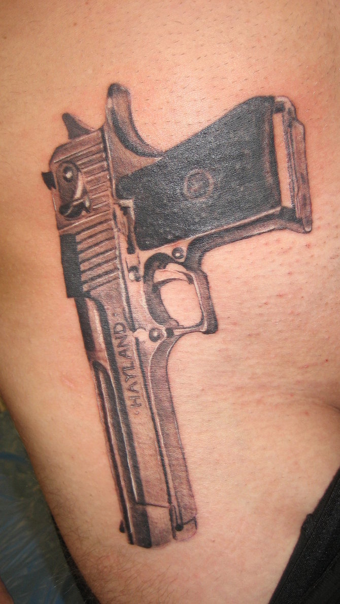 gun tattoos on hips