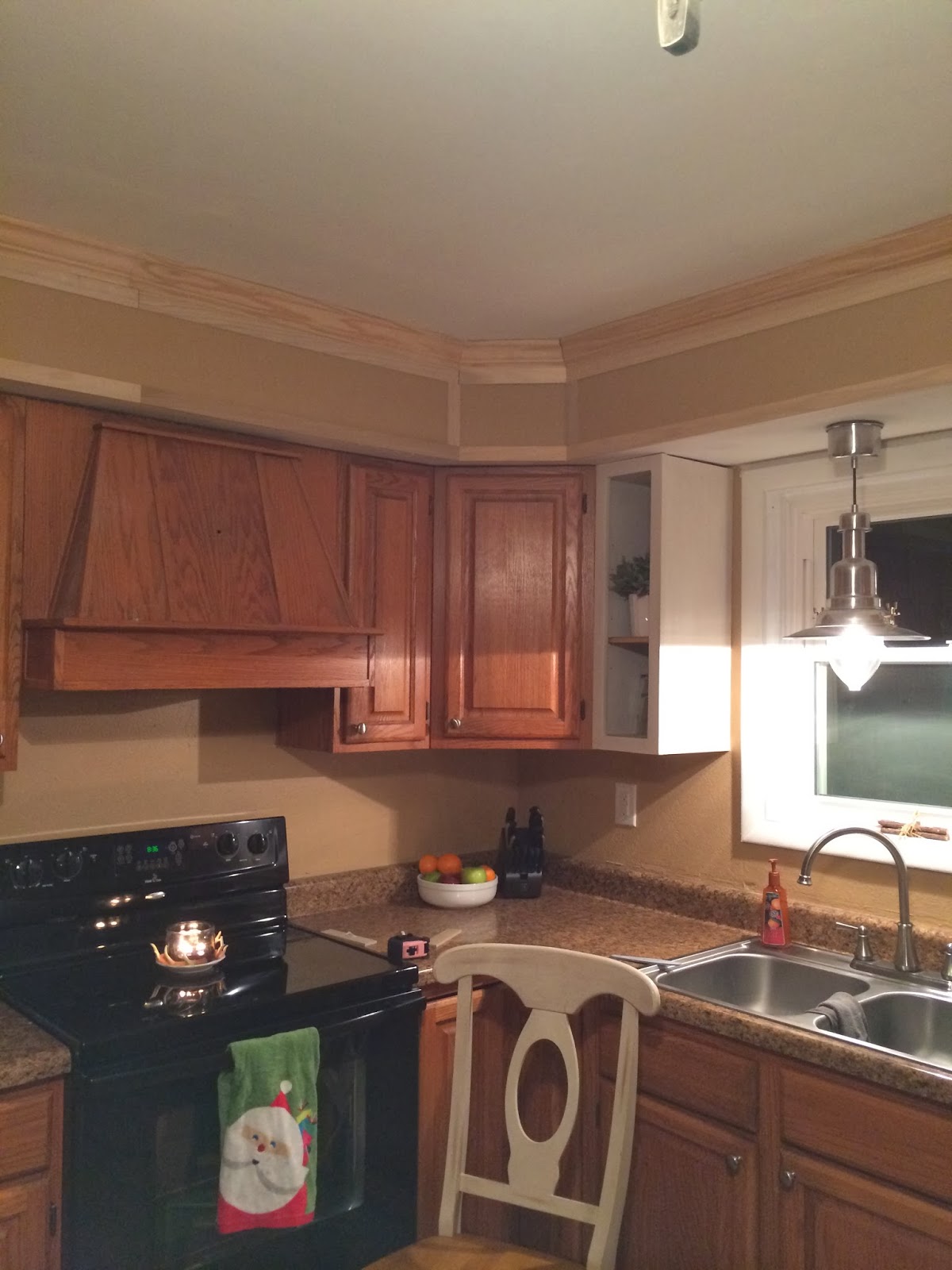 Kitchen cabinet soffit The walls are painted Olympic's Whispering Wind in an eggshell finish.