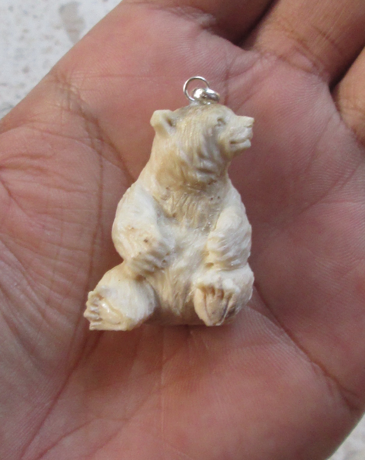 Carved Bear Bone Pendants in Antler Carved Bear Bone Pendants in Antler