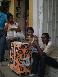 a man and woman sitting outside