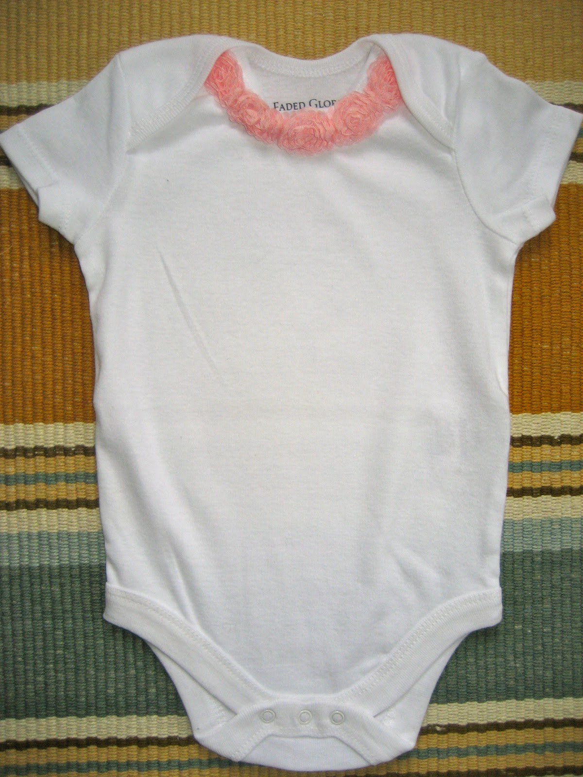 GraceAdkinsDesigns Baby Onesie with Pink Fabric Flowers Around the