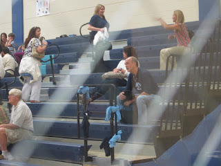 Fred and Coach watching the volleyball game. Fred and Coach watching the volleyball game.