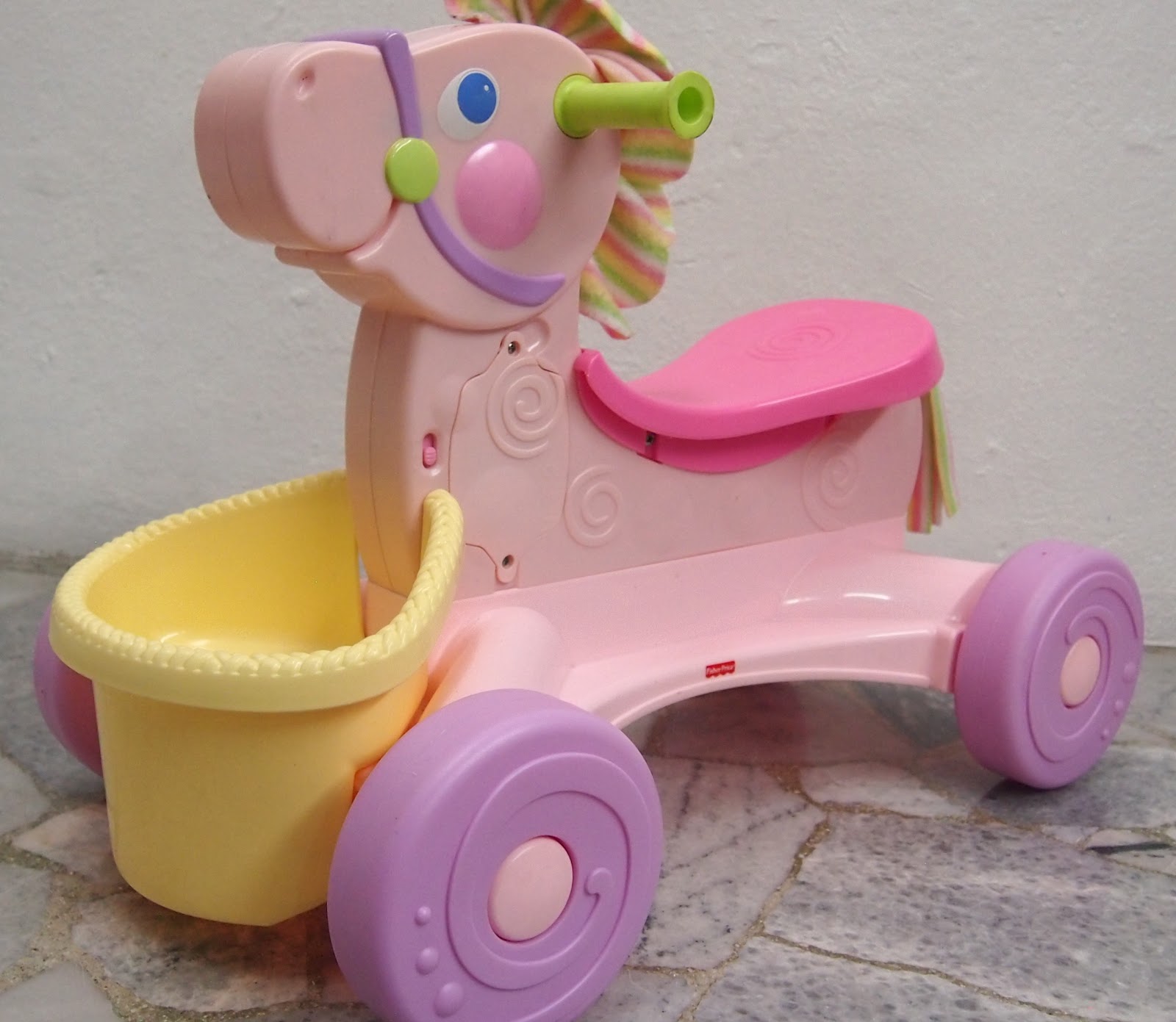 fisher price roll along musical pony