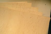 Close Up of seventeen Sheets speckled 4x8 Alder Veneer