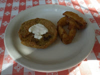 A saucer of fried green tomato and onion rings.