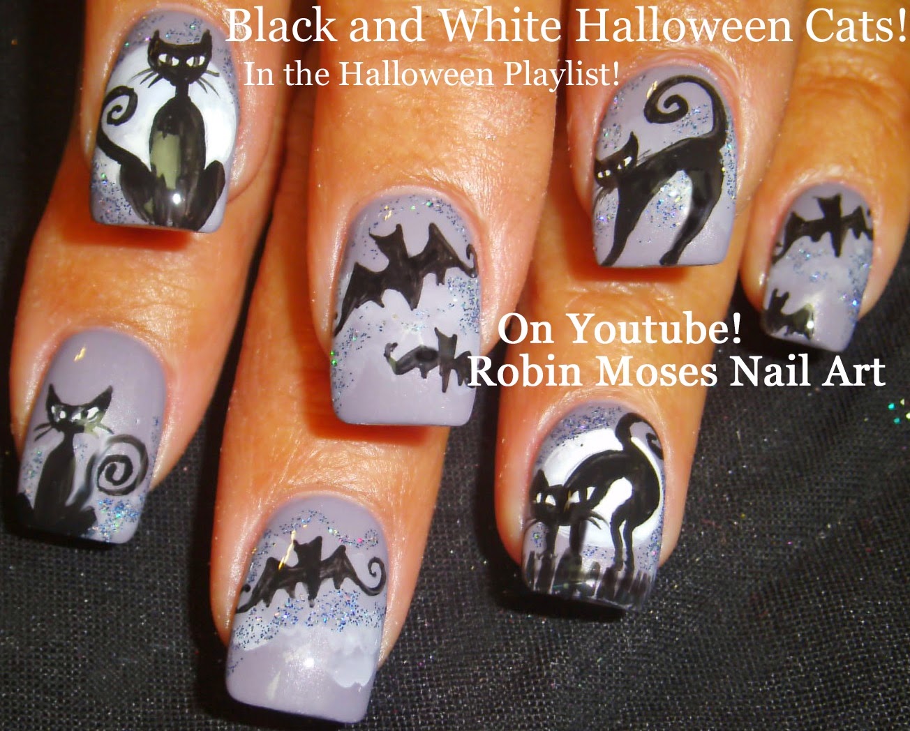 10. Elegantly Spooky Halloween Nail Design with Black Cats - wide 8