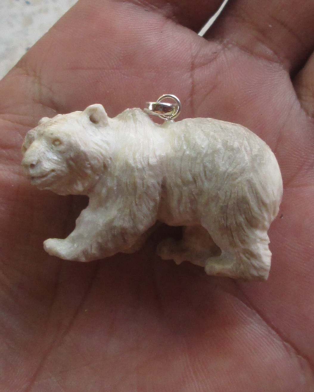 Carved Bear Bone Pendants in Antler Carved Bear Bone Pendants in Antler