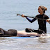 Kylie Jenner takes a Malibu surf with friend