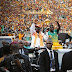 Ivory Coast's President waves as he holds the African Nations Cup 