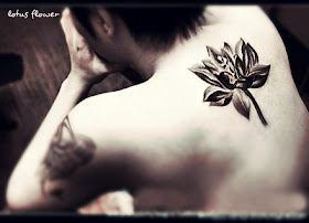 A vivid 3d lotus flower tattoo on the back