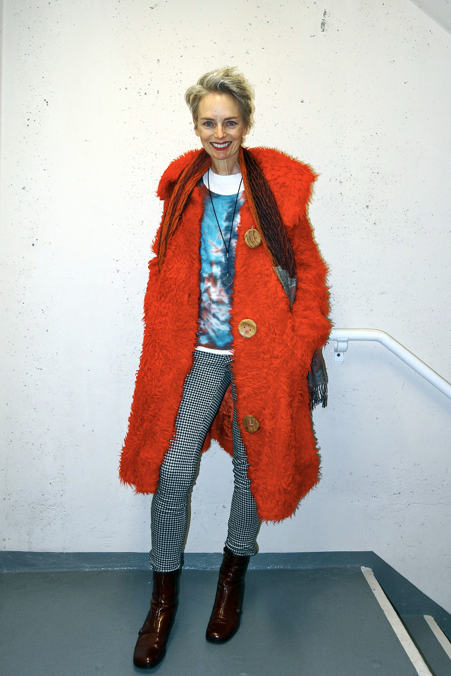 Melanie Kobayashi in shaggy red coat, heh, bag and a beret