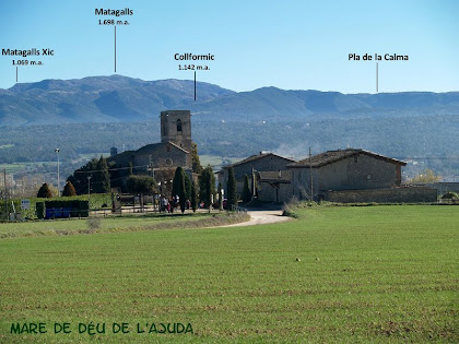 El nucli de l'Ajuda amb el Montseny al fons El nucli de l'Ajuda amb el Montseny al fons