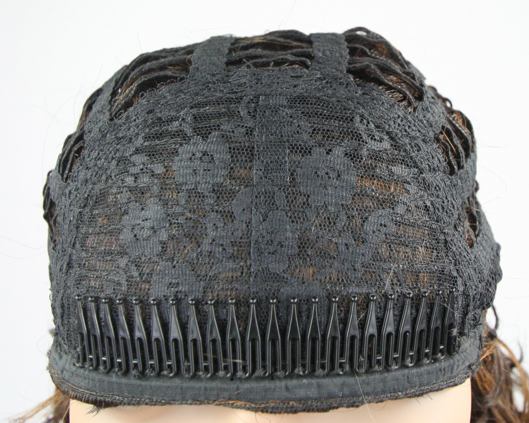 One large comb at front wig cap, and two small combs at nape are title=