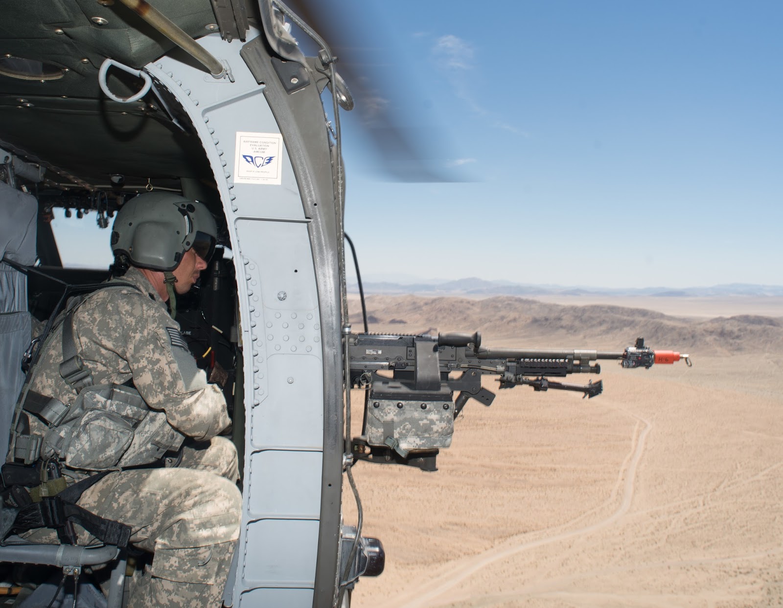 idaho army national guardsman sgt keo markwell crew chief from a company 1st battalion 183rd aviation reconnaissance battalion scans the terrain with idaho army national guardsman sgt keo markwell crew chief from a company 1st battalion 183rd aviation reconnaissance battalion scans the terrain with