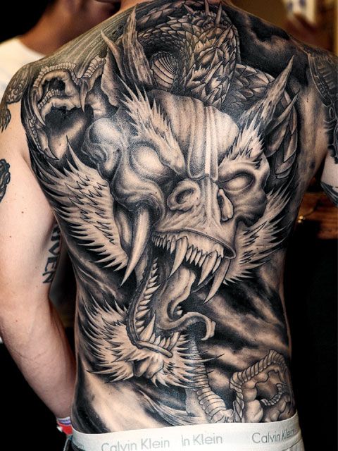 40 Tribal Dragon Back Tattoo Designs Background