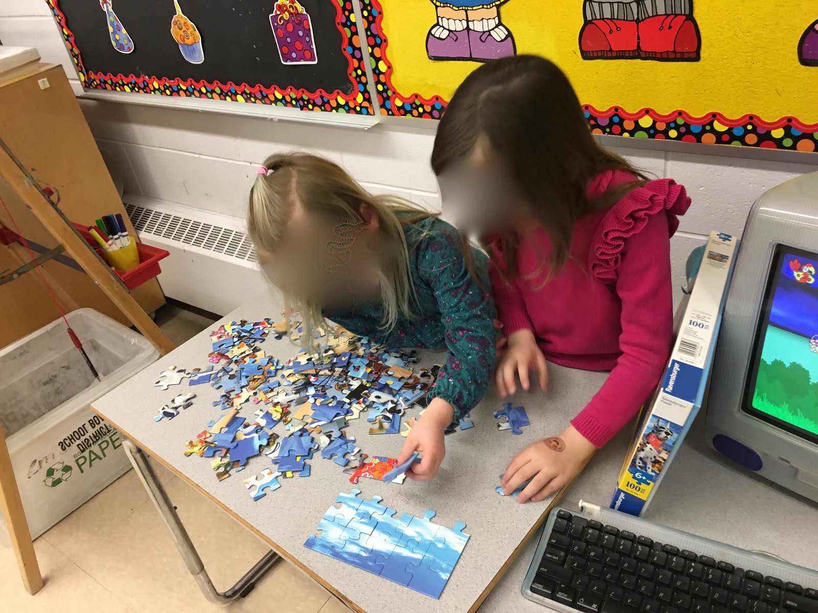 Teamwork completing a 100 piece puzzle
