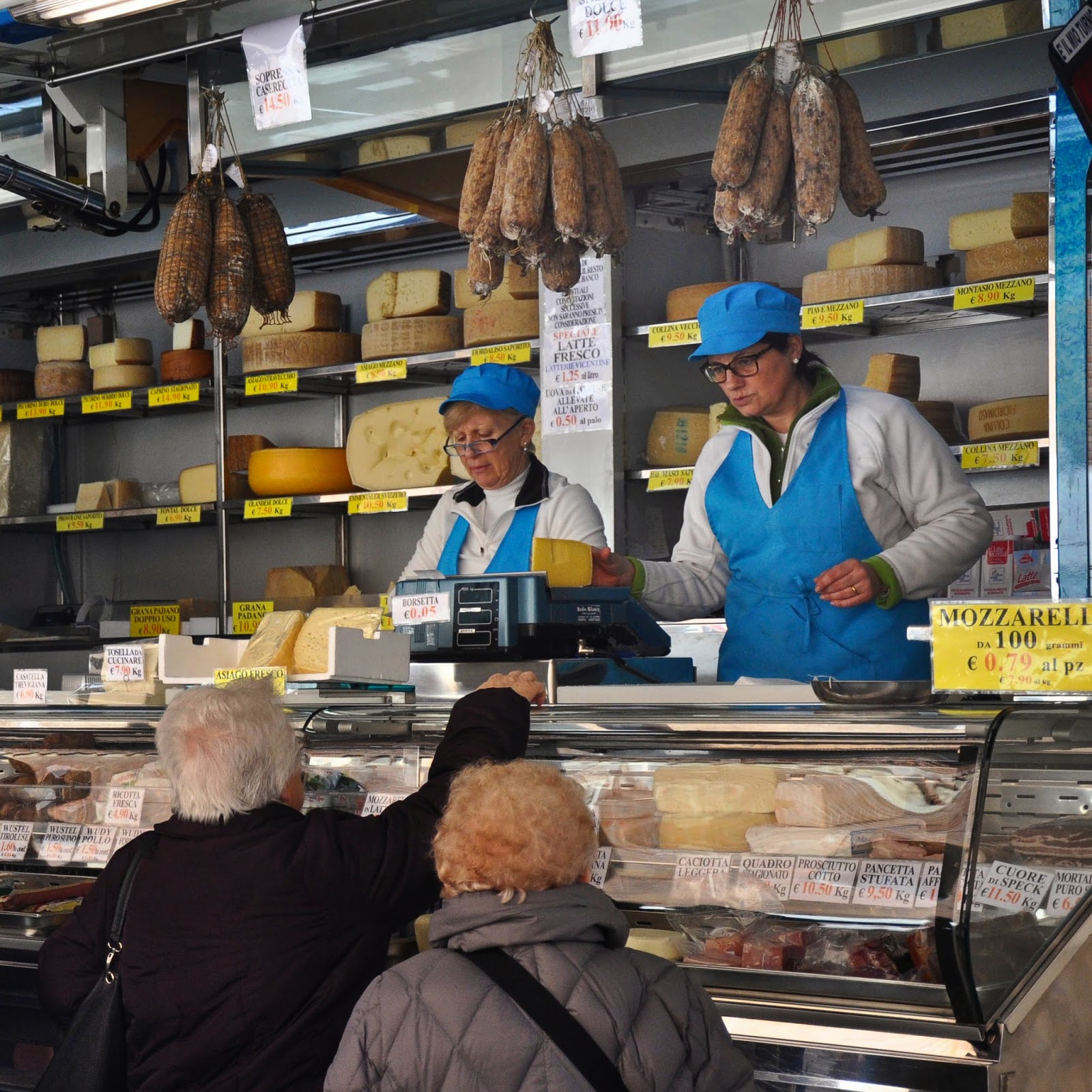 At the cheese and salumi stall at the Thursday market in Vicenza, Italy