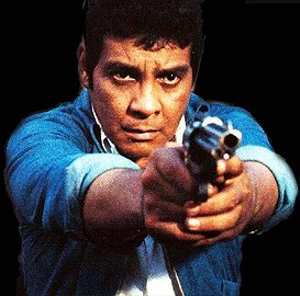 FPJ holding a gun pinoy movie blogger article on action films