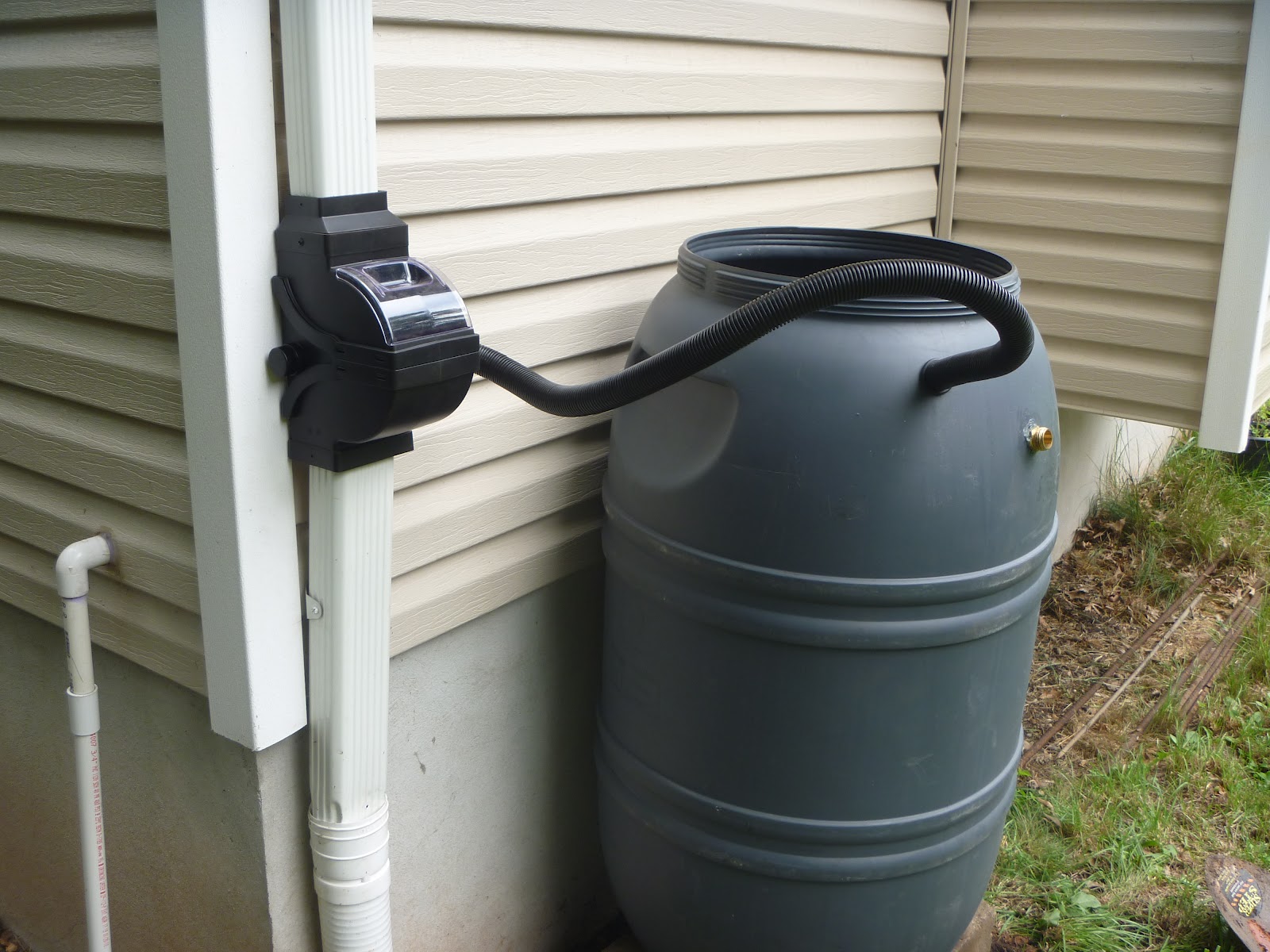down rain barrel gutter downspout hose underground drainage cut bit cautious gardener
