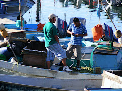 Two fishermen preparing to head out.