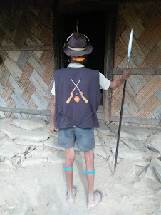 Aluh,  the deputy ANGH of Longwa village displaying the Konyak tribe coat of arms.