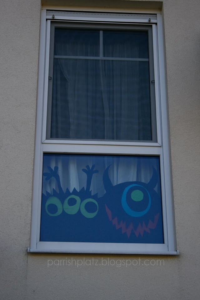 paper monsters in window