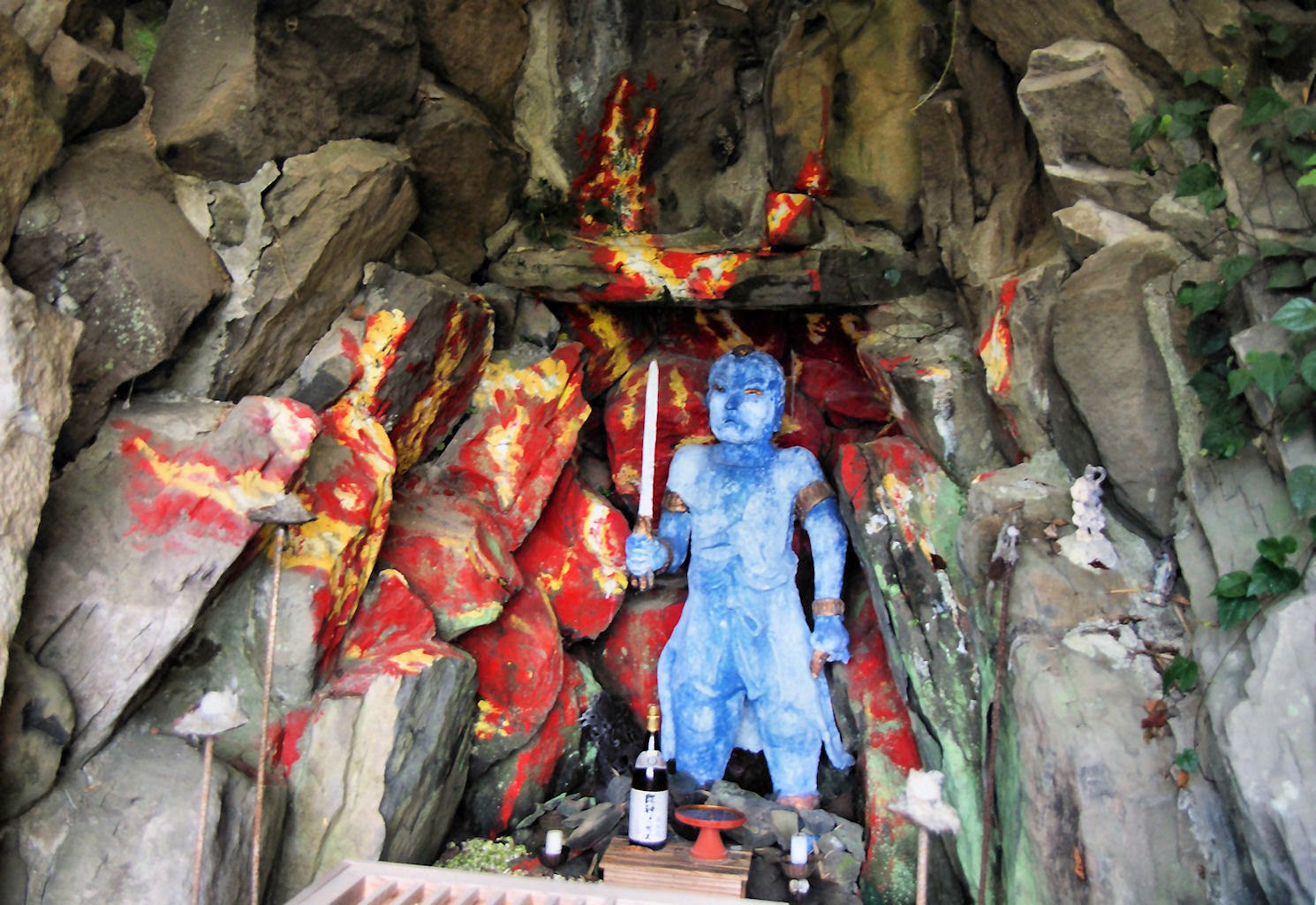 Fudo Myo statue painted bright blue Fudo Myo statue painted bright blue