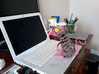 pipe-cleaner mouse sitting on my laptop