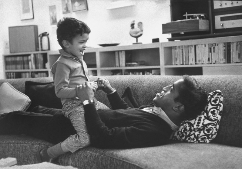 Sammy Davis Jr. playing with his son at home