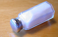 Ice causes the ice to melt faster, releasing the cool. image of a salt shaker laying on its side.