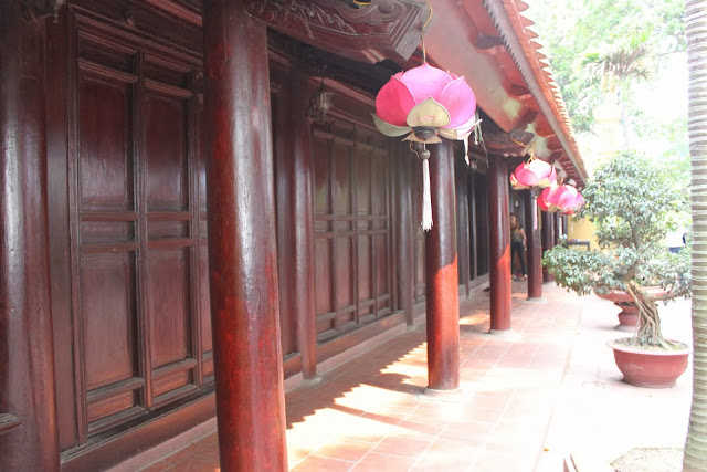The side view of Buddhist red temple with Lotus lanterns at Tran Quoc Pagoda in Hanoi, Vietnam The side view of Buddhist red temple with Lotus lanterns at Tran Quoc Pagoda in Hanoi, Vietnami, Vietnam