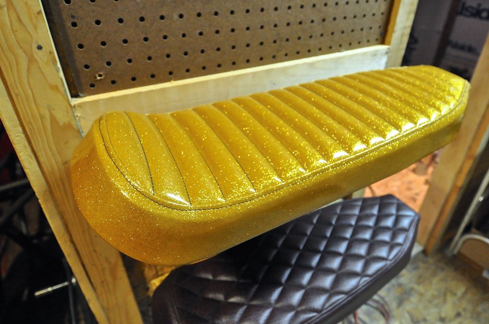 Counter Balance Motorcycles New Gold Metal Flake Tuck and Roll Seat in the shop!