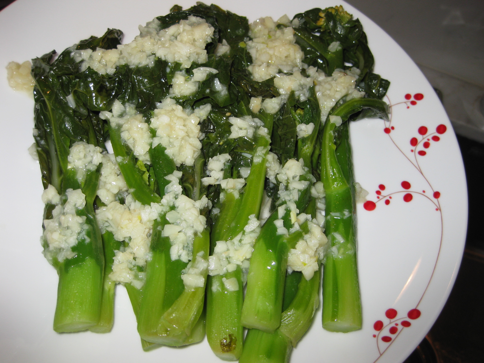 Little Ms. Piggys Cooking Gai Lan with Garlic Sauce