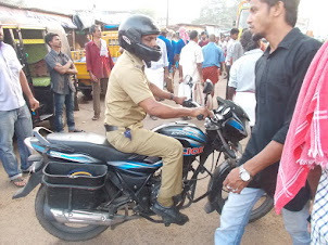 Police inspector at scene of suicide by hanging on Basin Road in Ernakulam market.