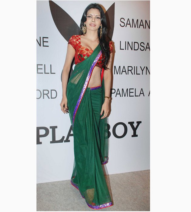 Sherlyn Chopra looking sexy in Green Saree and Red Blouse @ Playboy Press Meet  