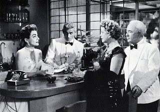 Joan Crawford, with Jeff Chandler, Natalie Schafer (the future Mrs. Thurston Howell III of "Gilligan's Island" fame), and Cecil Kellaway, in "Female on the Beach," 1955.