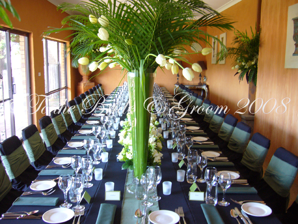 Our black tablecloths black chair covers with moss green suede double sash 