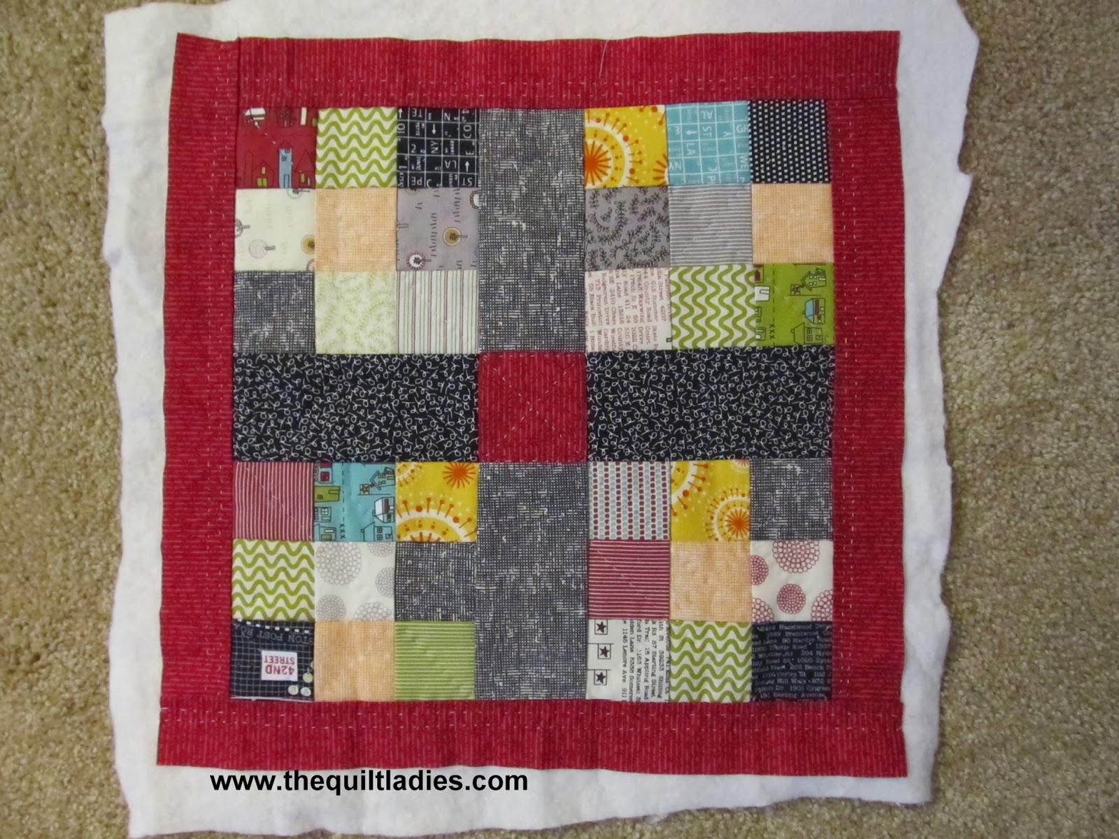 free how to make a quilted pillow with triangles and squares