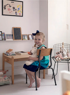 Irenie Cossey's youngest daughter in her room, with a vintage chair and school desk and a Harry Bertoia wire chair, photographed by Tim Young Irenie Cossey's youngest daughter in her room, with a vintage chair and school desk and a Harry Bertoia wire chair, photographed by Tim Young