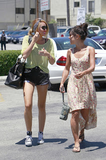 Miley Cyrusmeeting with a friend at a parking lot to go and get something from Starbucks