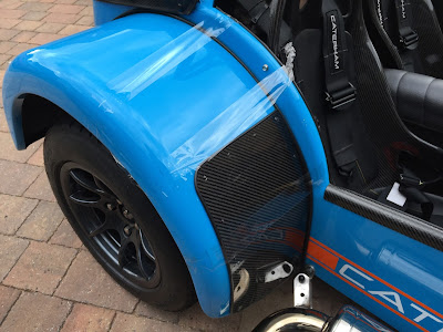 Caterham with taped wing after a minor incident with an X5!