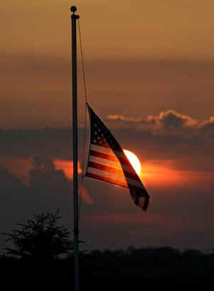 American_Flag_Half_Mast_at_Sunset.jpg
