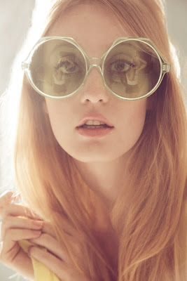 fresh skin, natural beauty, woman wearing enormous sunglasses